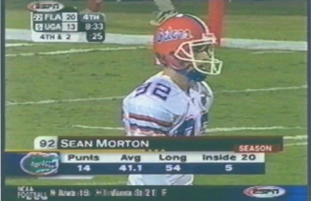 Sean Morton, number 92, on the field for the Florida Gators in an ESPN broadcast of Florida vs. Georgia, with his season punting stats on screen.